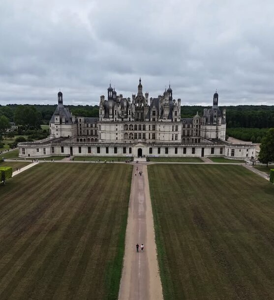 Aerial view of Château de Chambord, Loire Valley, showing the castle's rooftop terrace and formal gardens