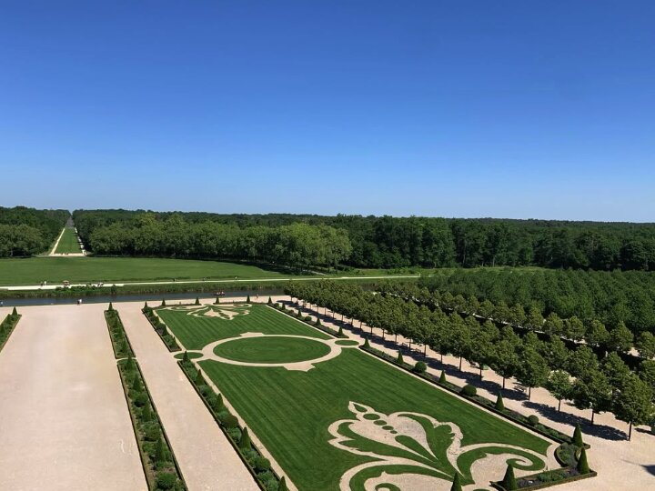 Formal gardens of Château de Chambord from the canal approach